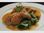 Larded leg of rabbit, served with steamed spinach